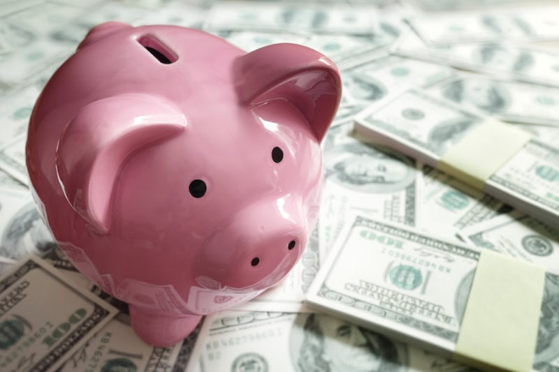 5 Ways to Lower Your Winter Heating Bill. Piggy bank on money concept for business finance, investment, saving or retirement fund
